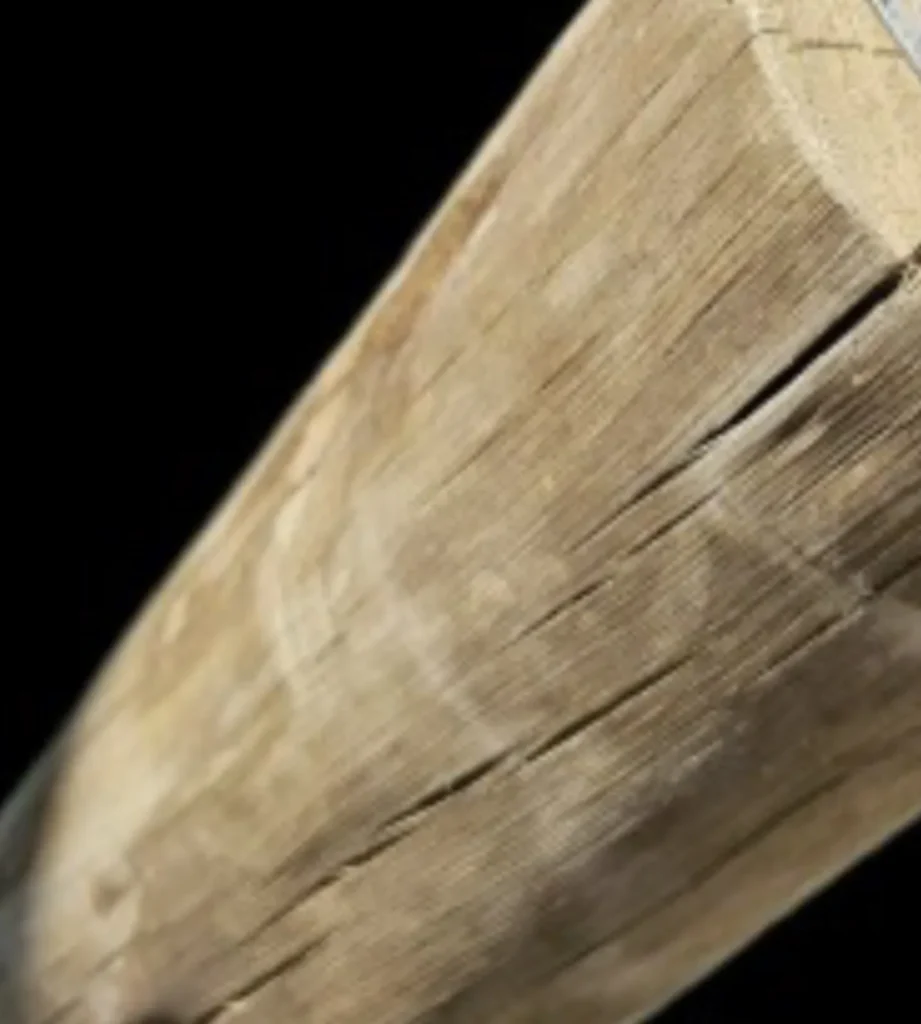 Close-up of natural wood grain, highlighting structural qualities important for tiki hut construction, emphasizing durability and aesthetic appeal.