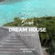 Tropical landscape featuring a serene beach and lush greenery, emphasizing the concept of a dream house by the water, ideal for a tiki hut bar setting.